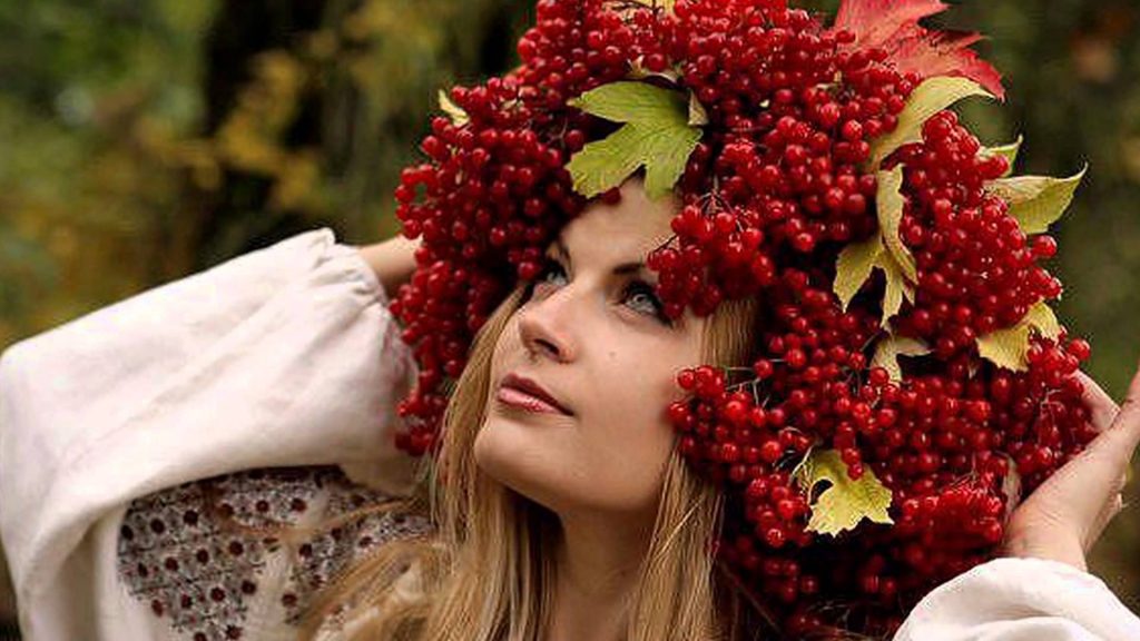 Girl with a wreath of viburnum