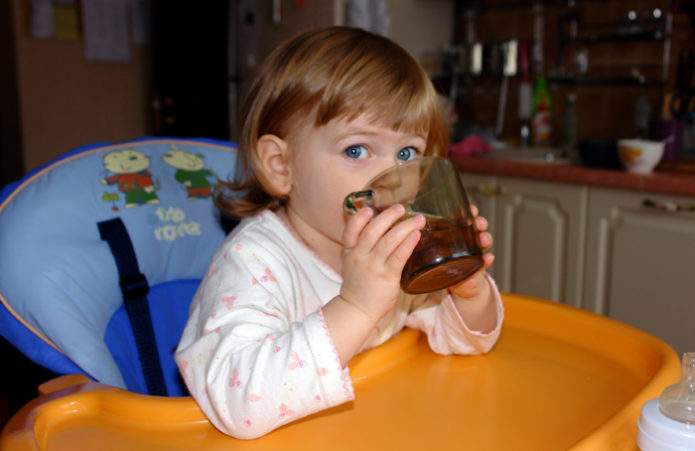 Child drinks from a glass